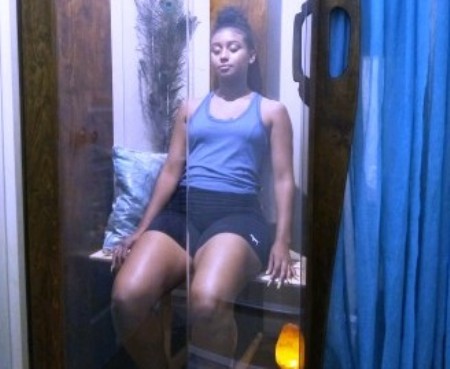 Guest enjoying salt therapy at AGLOW Crystal Healing Wellness Center